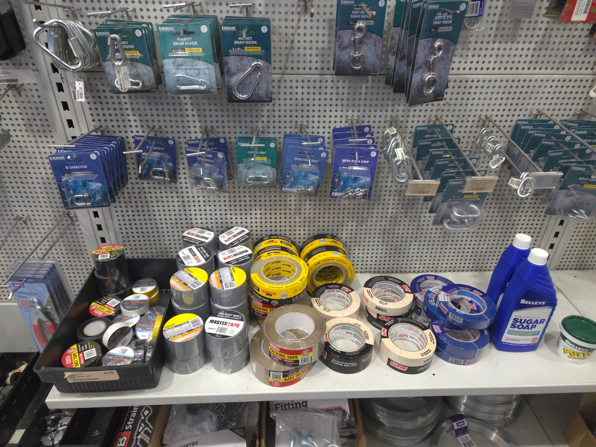 A Shelf Filled With a Variety of Tapes and Cleaning Supplies in a Store — Stockers & Partridge In Paterson, NSW