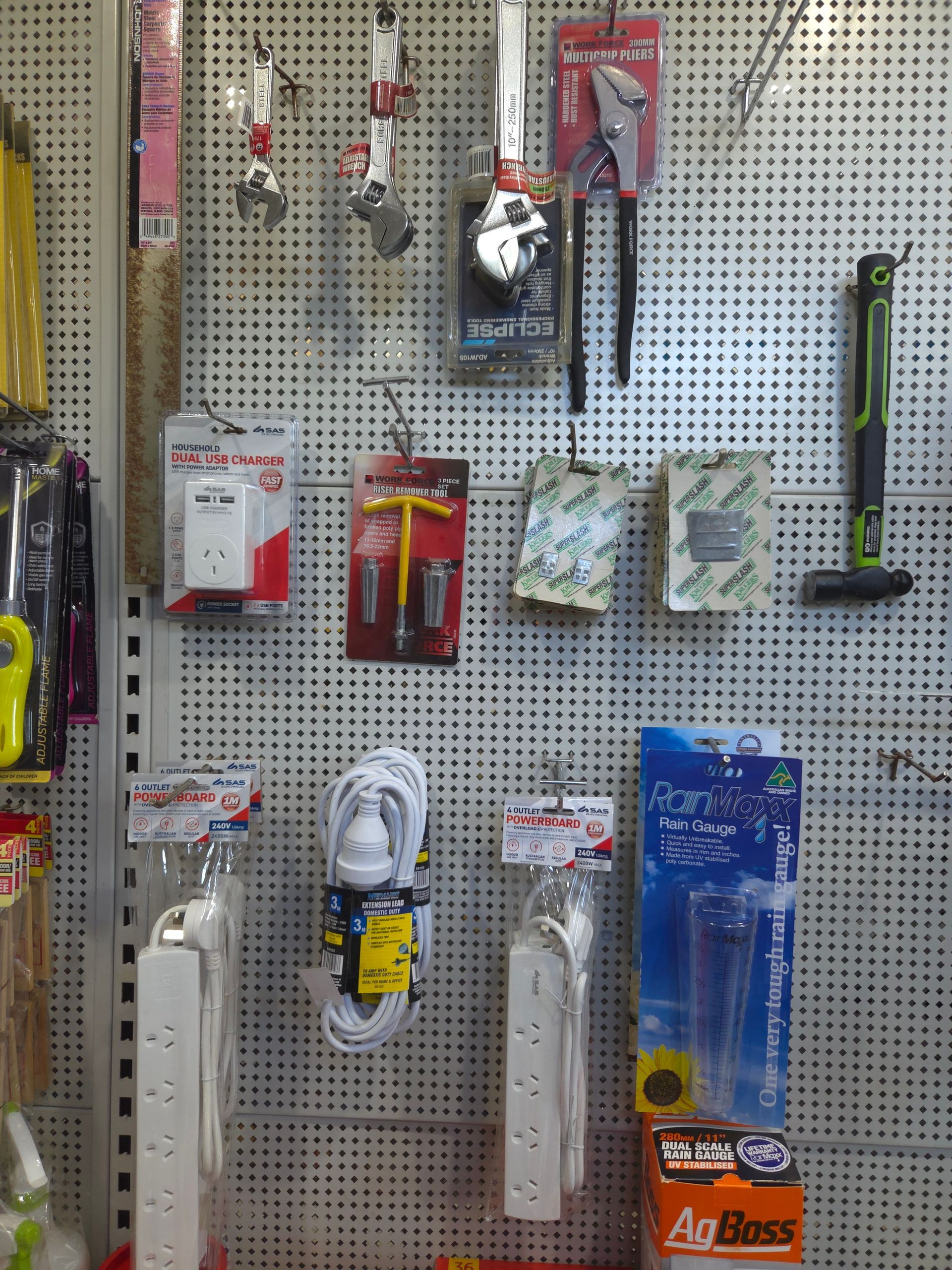 A Bunch of Tools Are Hanging on a Wall in a Store — Stockers & Partridge In Paterson, NSW