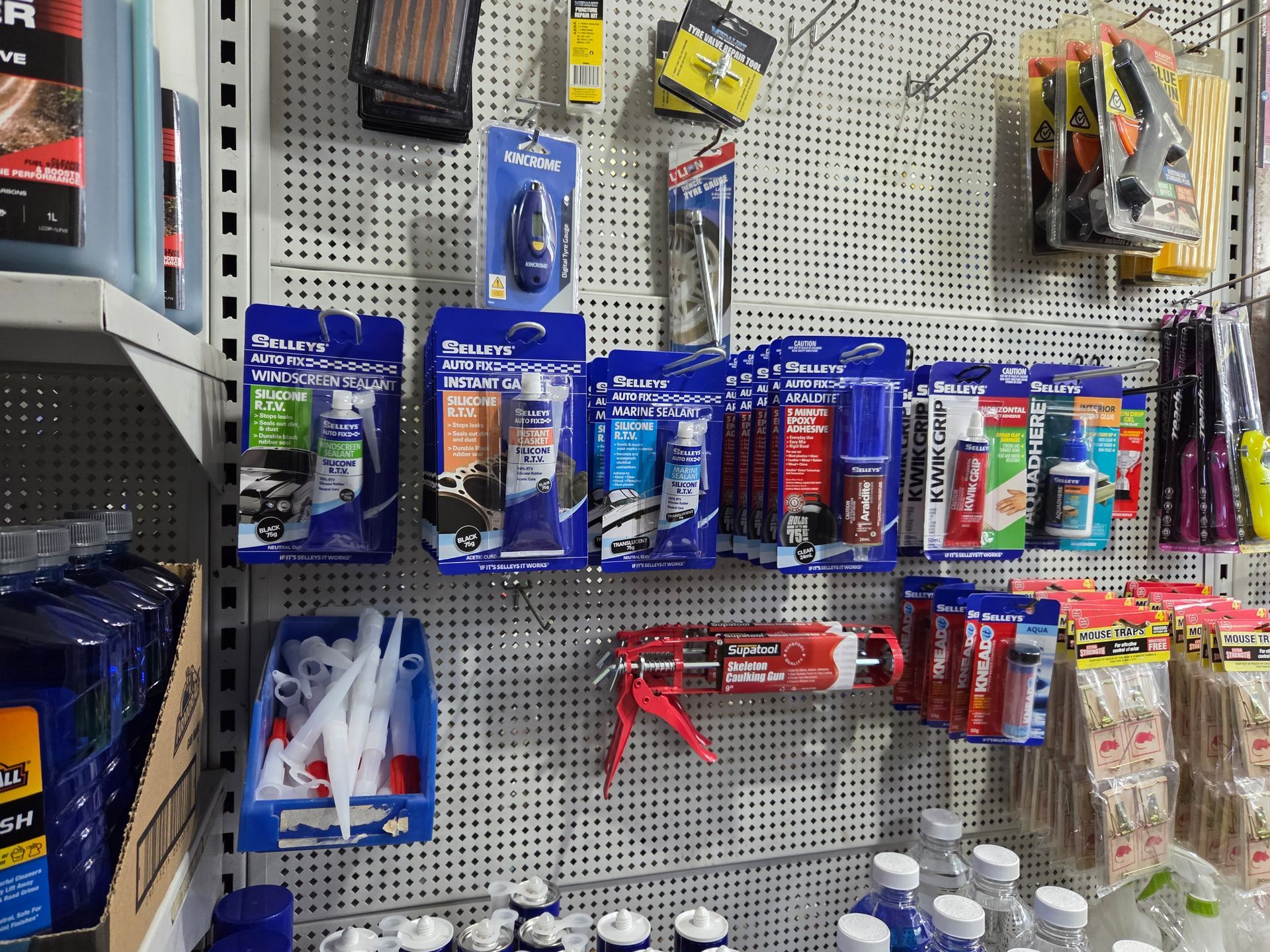 A Wall Filled With a Variety of Tools and Bottles — Stockers & Partridge In Paterson, NSW