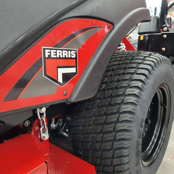 A Red Ferris Lawn Mower With a Black Tire — Stockers & Partridge In Maitland, NSW