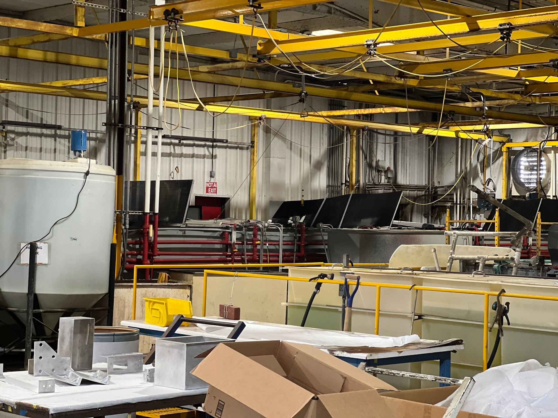 A warehouse with a lot of boxes on the floor