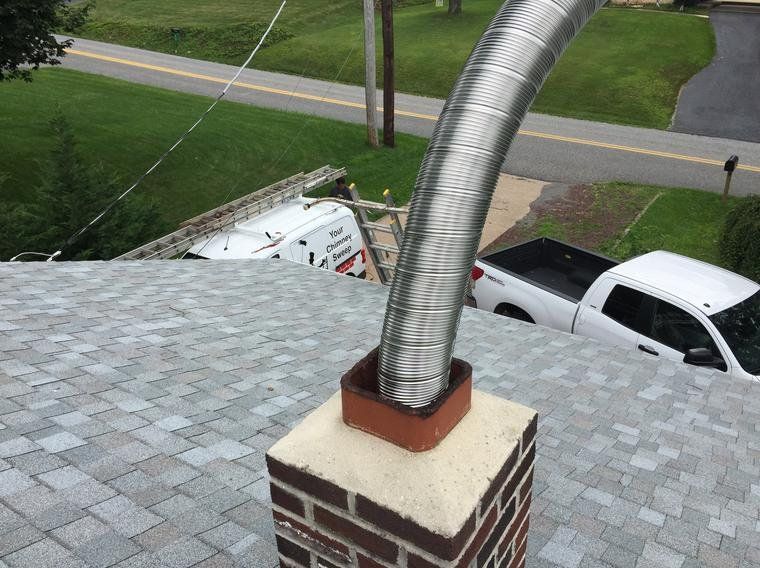 Chimney Cleaning Using Big Pipes — Mechanicsburg, PA — Your Chimney Sweep