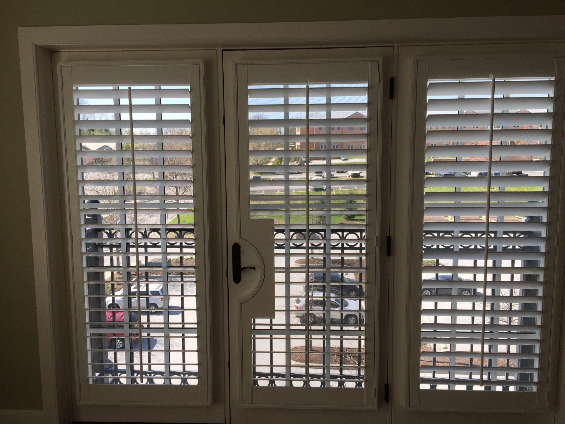 Plantation shutters with French door cut-out