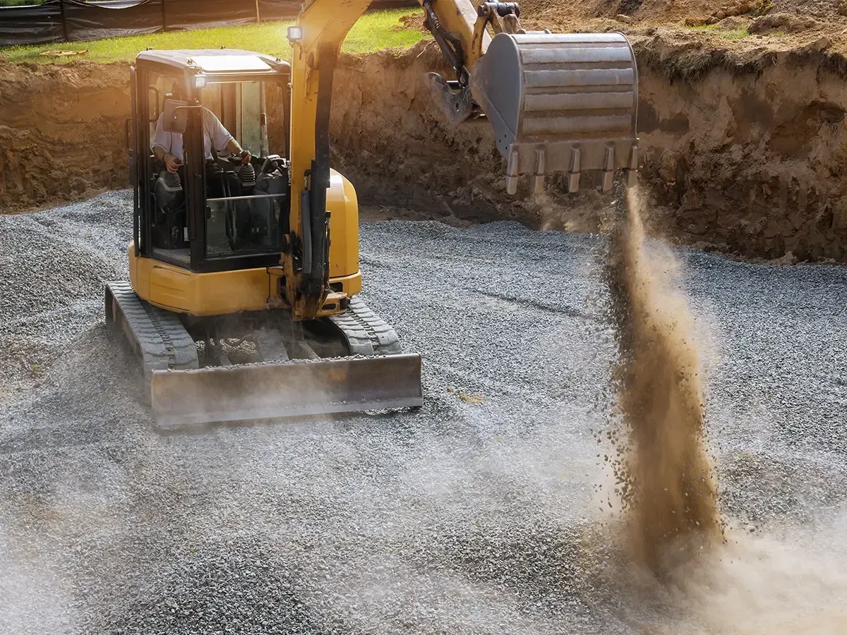 Gravel driveway grading using skid steer