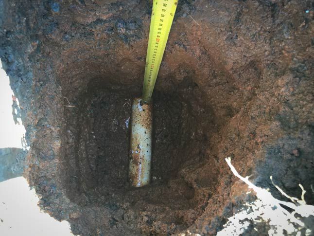 Hydrovac crew exposing joint in buried utility vault for inspection