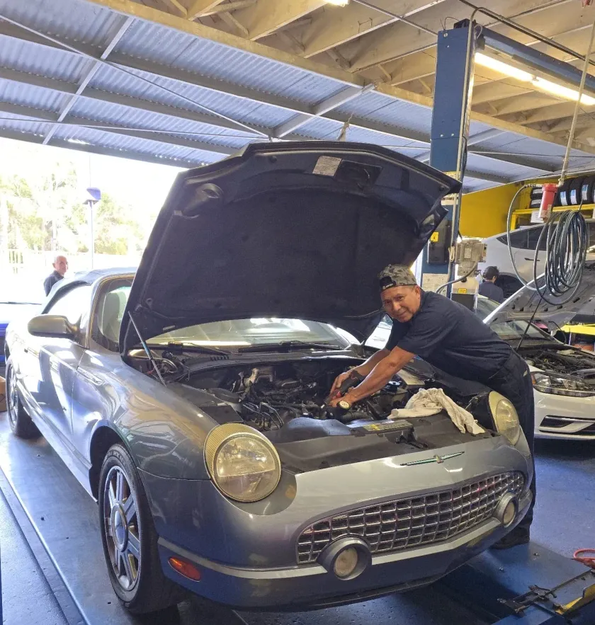 Mechanic working on a car | Carotech Automotive