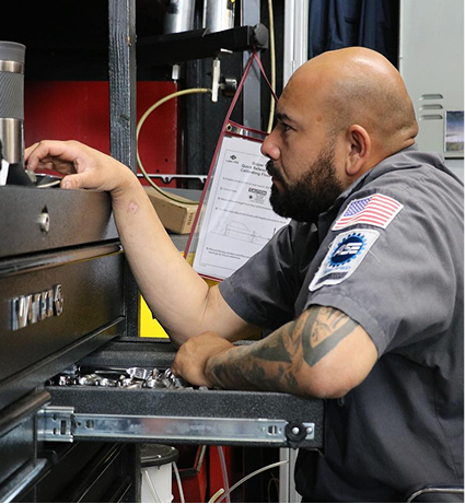 Machanic in garage | Carotech Automotive