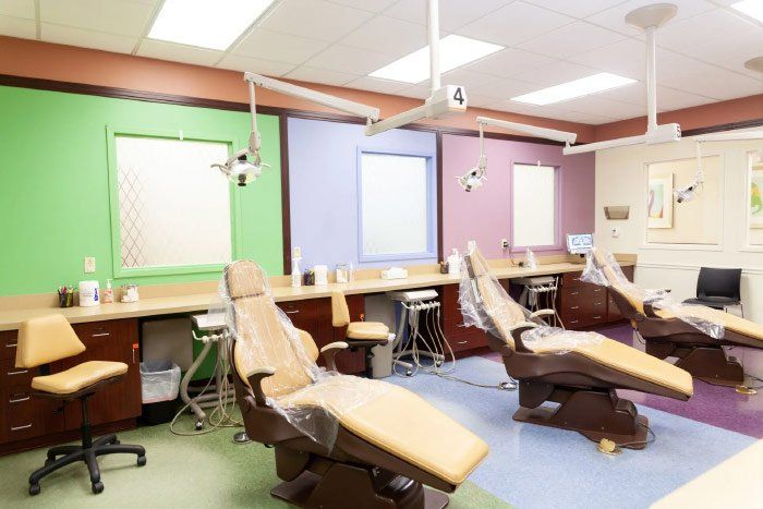 A row of dental chairs in a dental office
