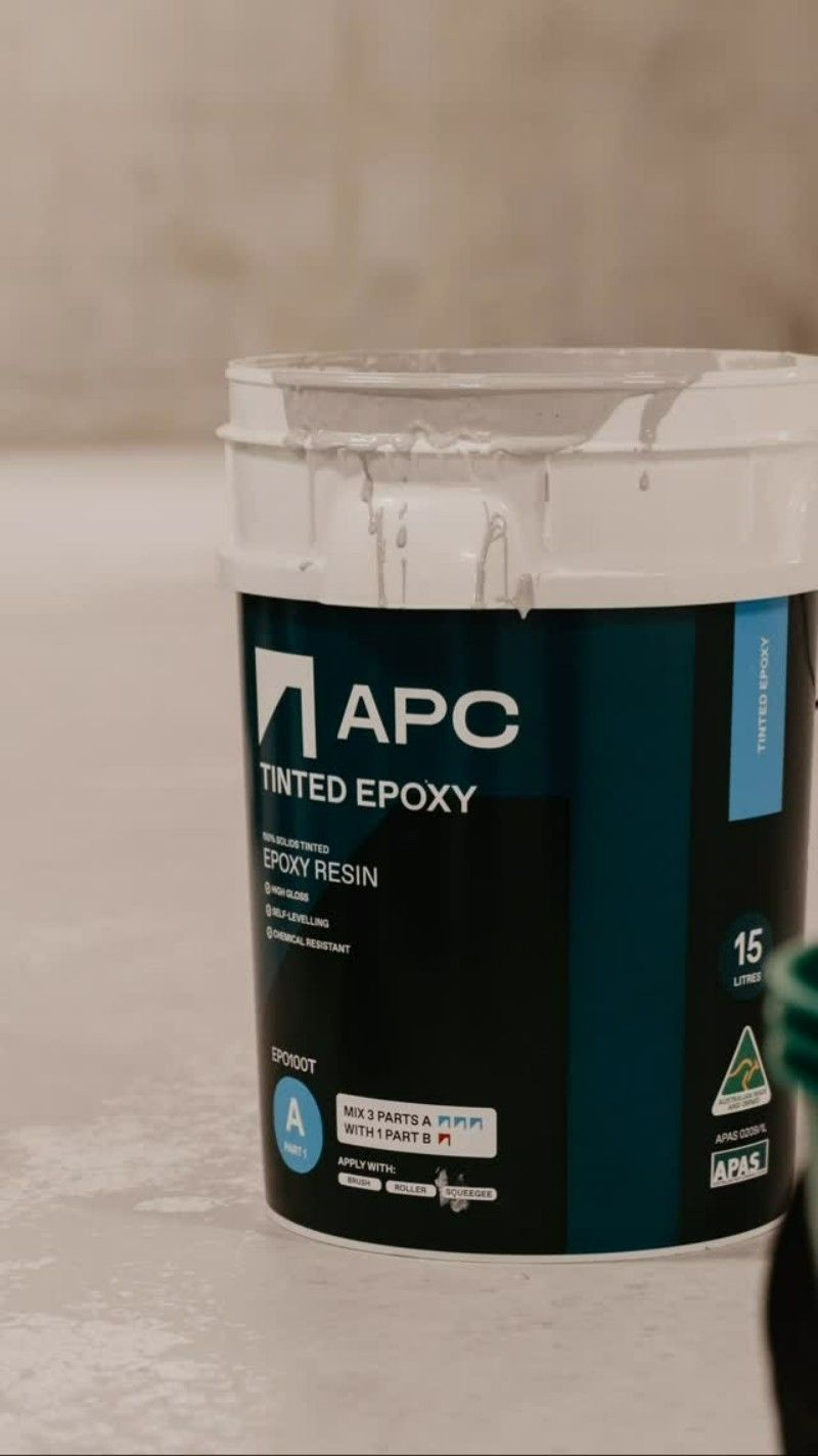 A Bucket of Tinted Epoxy is Sitting on a Table — Premier Epoxy Flooring Wollongong in Wollongong, NSW