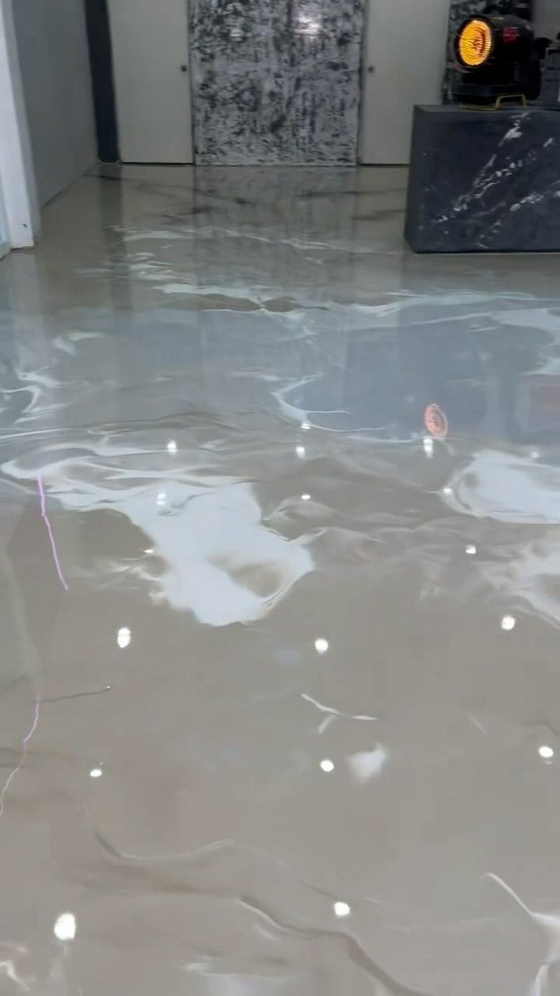 A Room With a Shiny Floor That Looks Like a Pool of Water — Premier Epoxy Flooring Wollongong in Wollongong, NSW