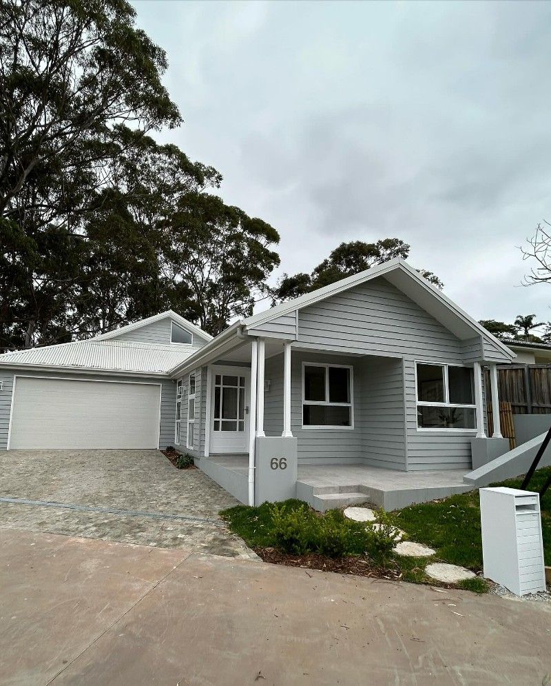 A White House With a Driveway and Trees in the Background — Premier Epoxy Flooring Wollongong in Wollongong, NSW
