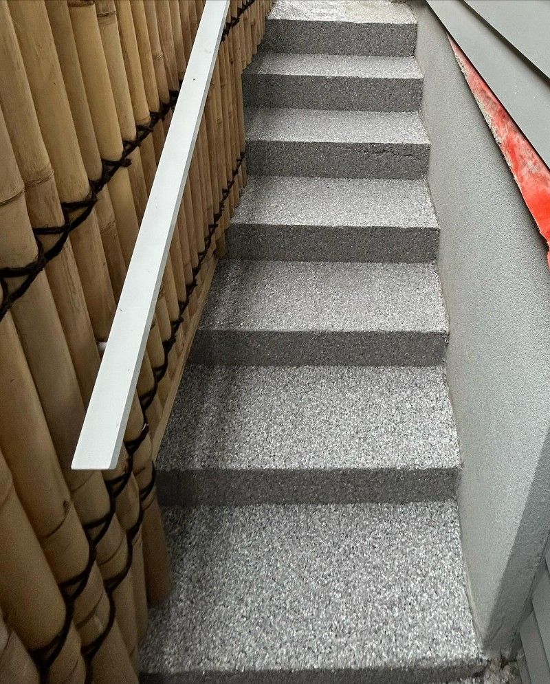 A Set of Stairs Leading Up to a Wooden Fence — Premier Epoxy Flooring Wollongong in Wollongong, NSW