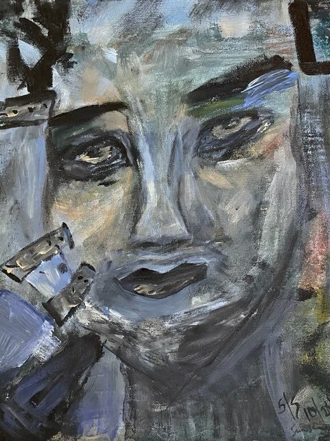 A close up of a painting of a woman 's face.