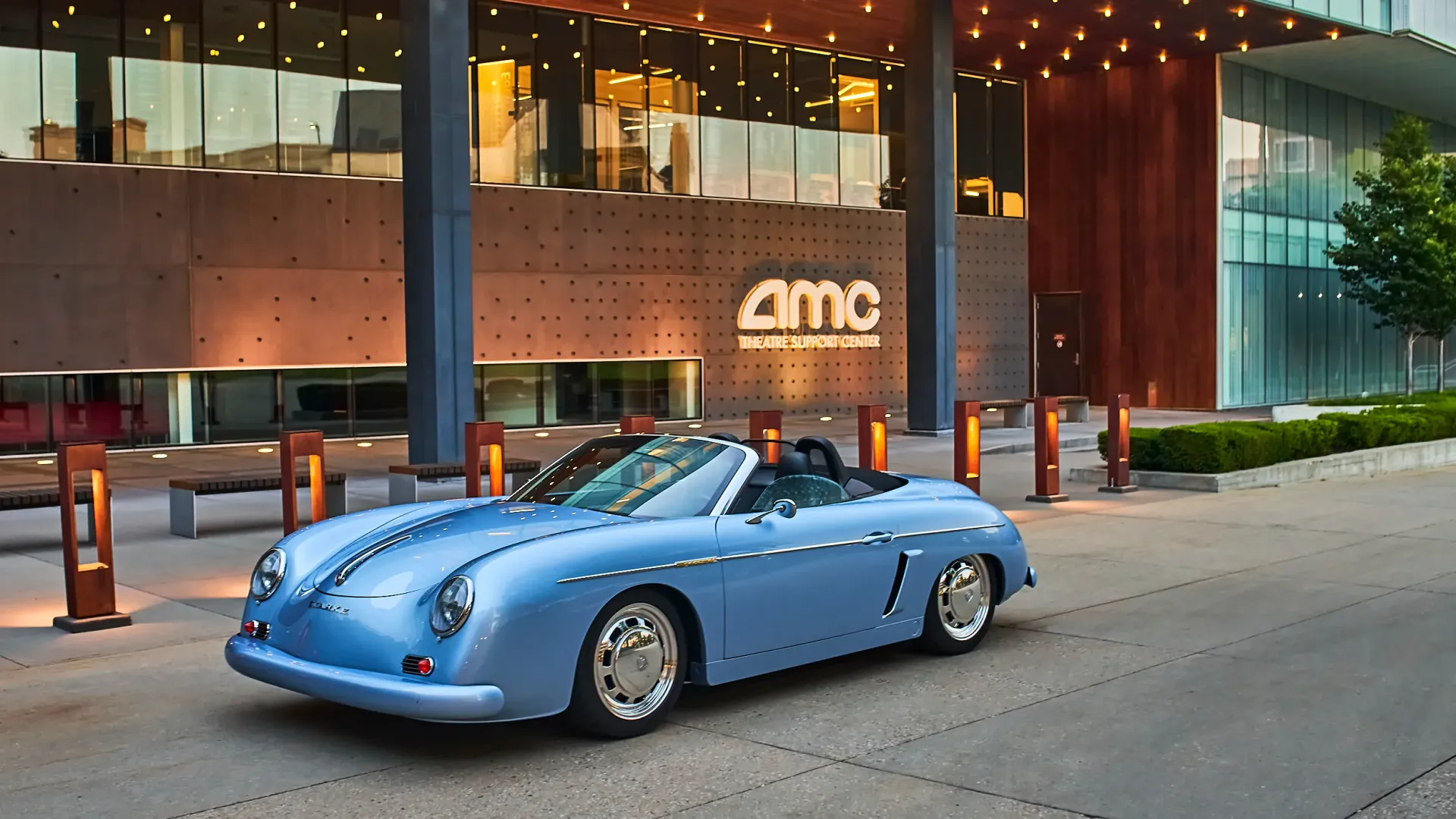 Ice Blue '55 Starke Speedster with convertible top down, sitting in front of office building in Leawood, Kansas