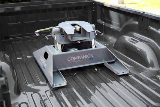 Fifth-wheel hitch mounted in a pickup truck bed, branded 
