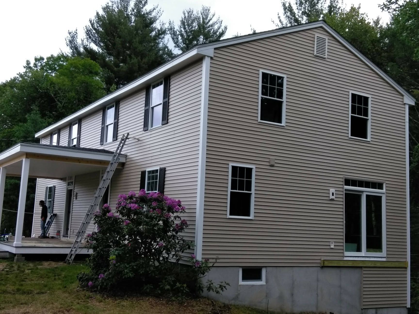 A house with a ladder on the side of it