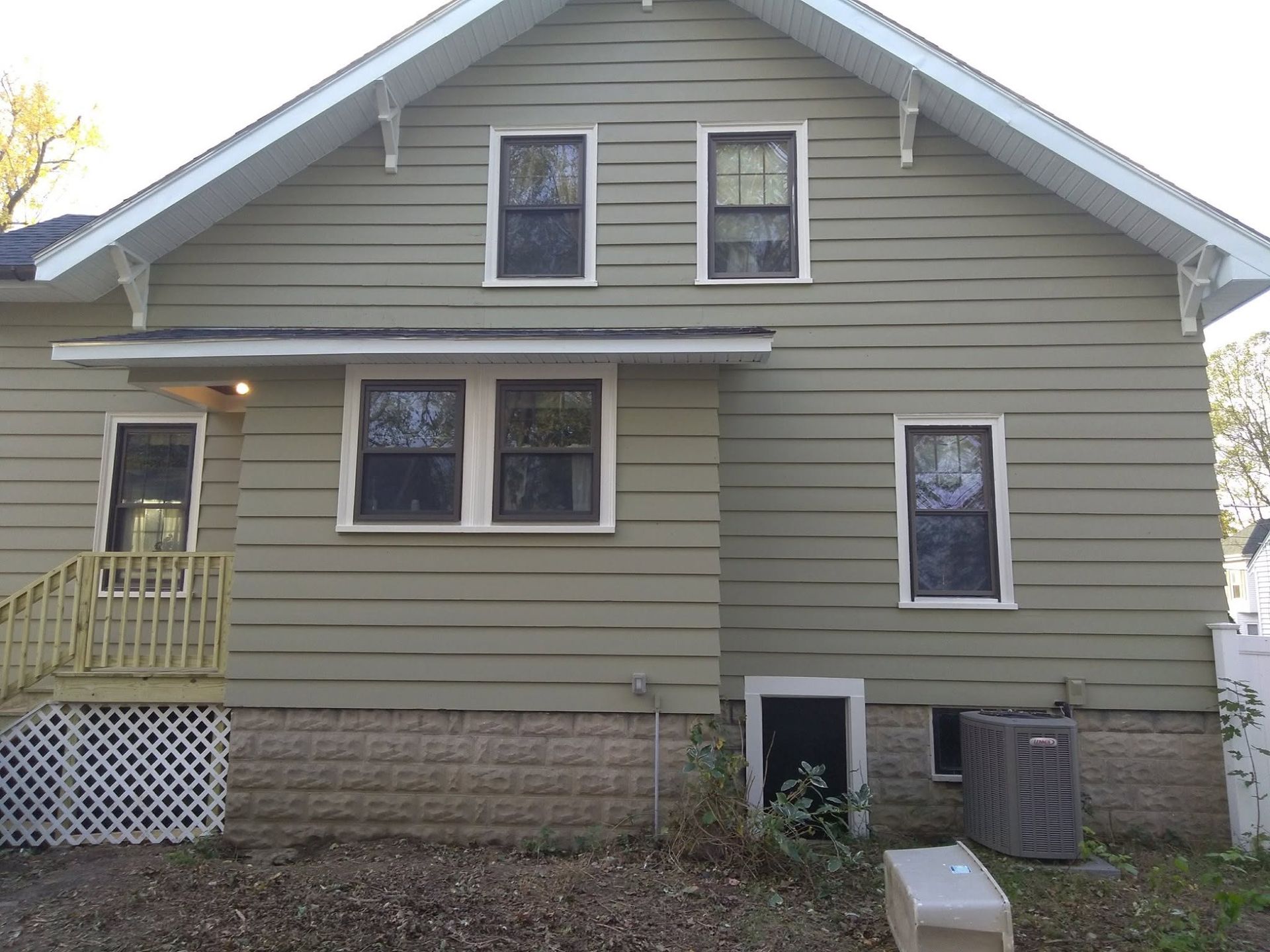 The back of a house with a lot of windows