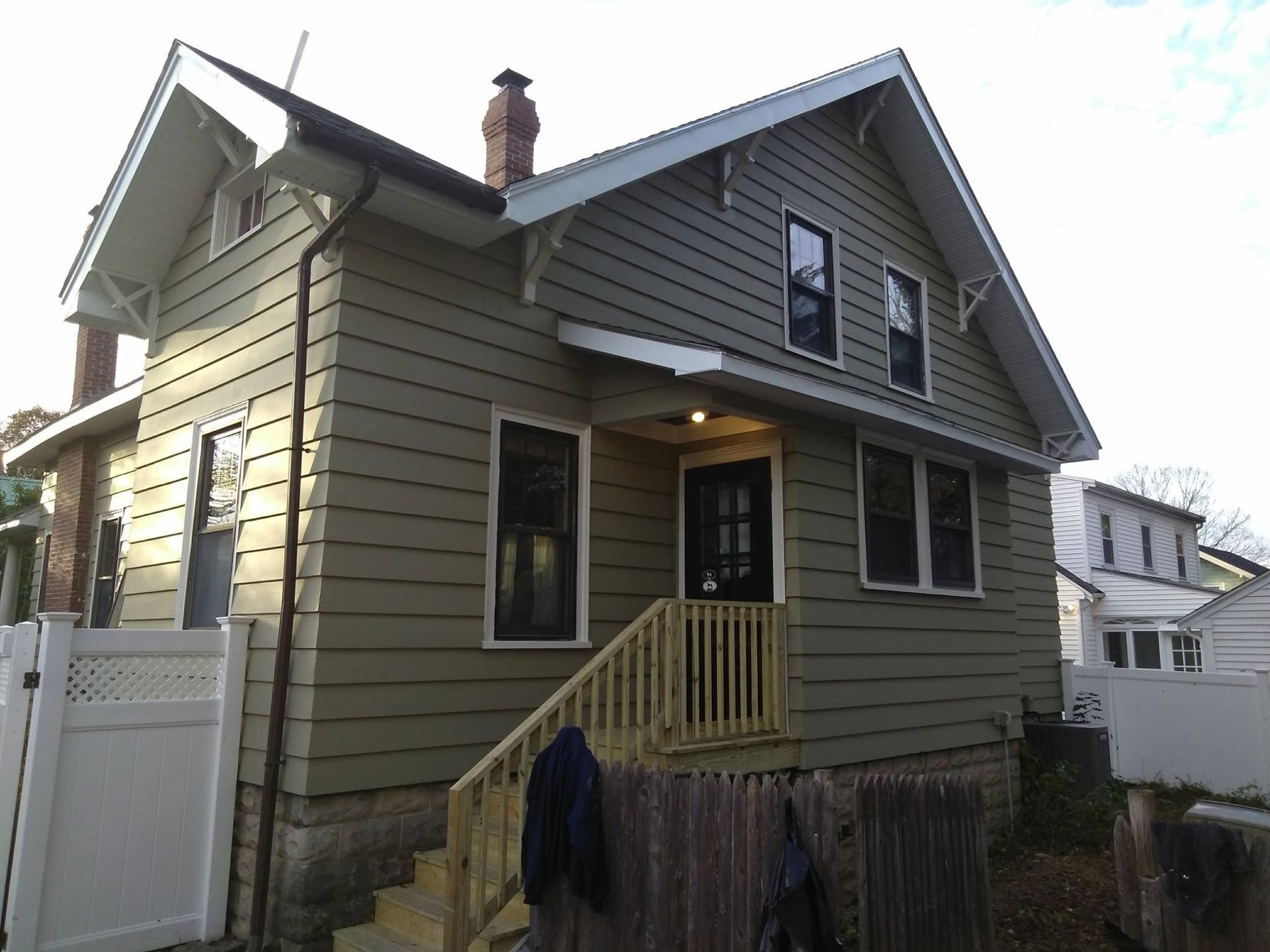 A house with stairs leading up to the front door