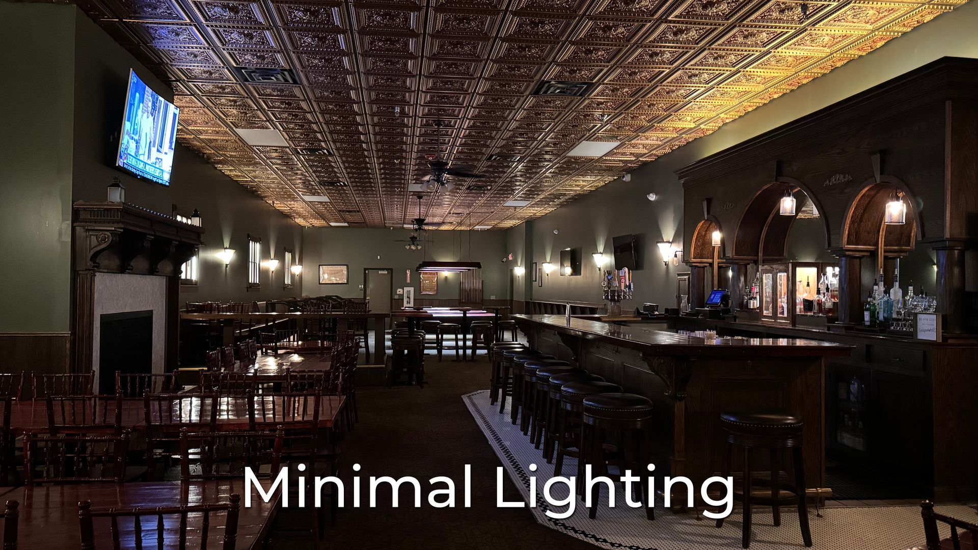 A restaurant with a bar and tables and the words minimal lighting on the bottom