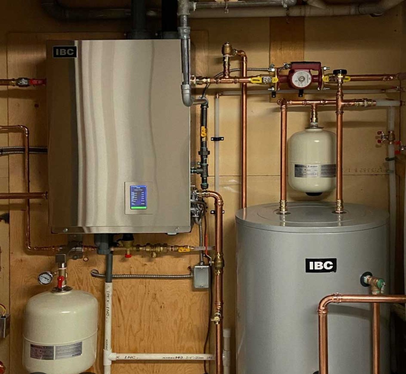 A room with a boiler that says ibc on it