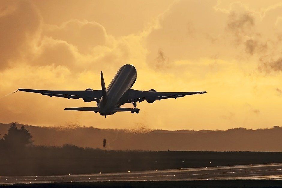 AOG - An aircraft gets airborne at sunset