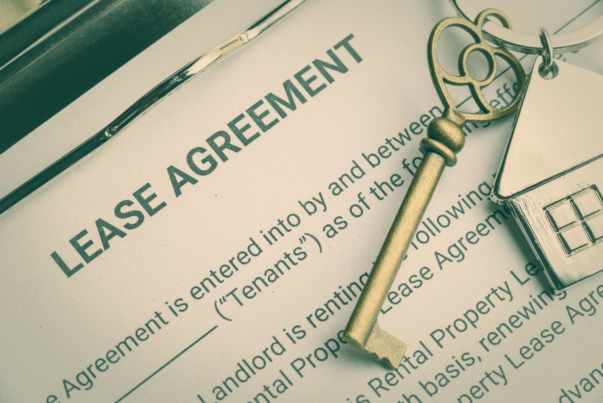 Business lease agreement concept : Keychain on a lease agreement form. Lease agreement is a contract