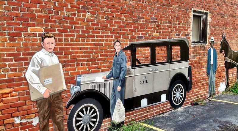 A painting of two men standing next to a car on a brick wall