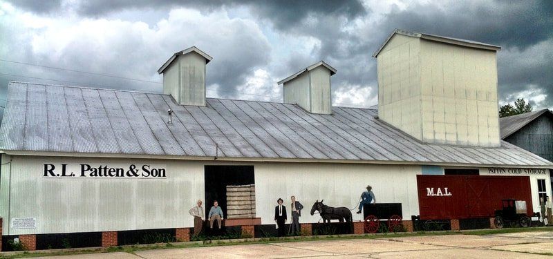 A white building with the name r.l patten & son on it