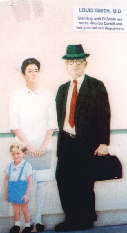 A cardboard cutout of louis smith m.d. and his family