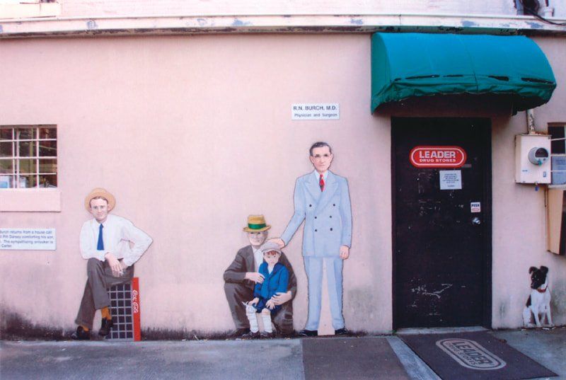 A building with a sign on the door that says lacomb