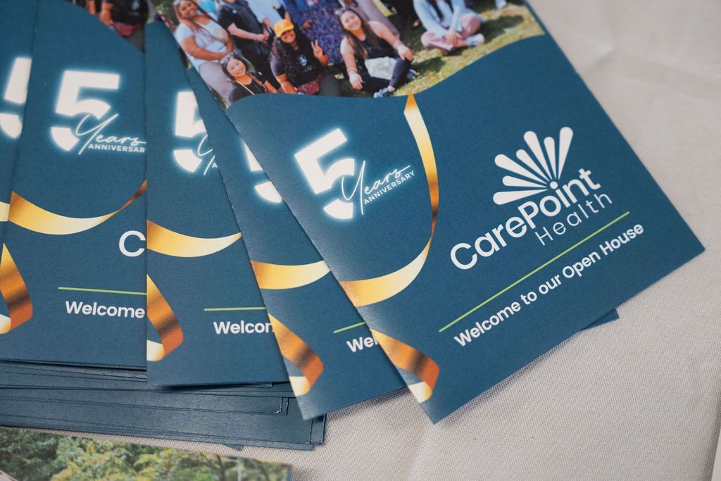 A stack of carepoint health pamphlets on a table