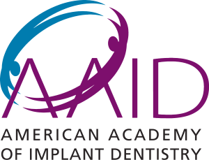 The logo for the american academy of implant dentistry