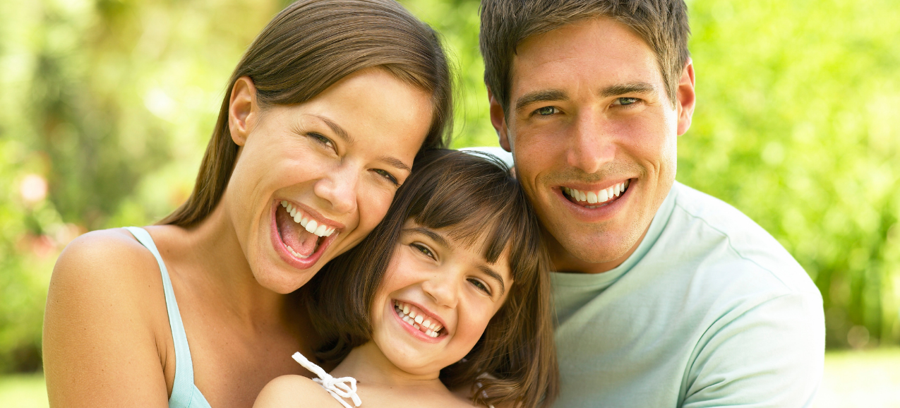mom dad and child smiling | Family dentist for crowns, whitening, veneers | Lawson and Richmond MO