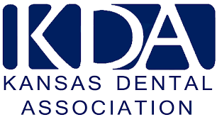 The logo for the kansas dental association is blue and white.