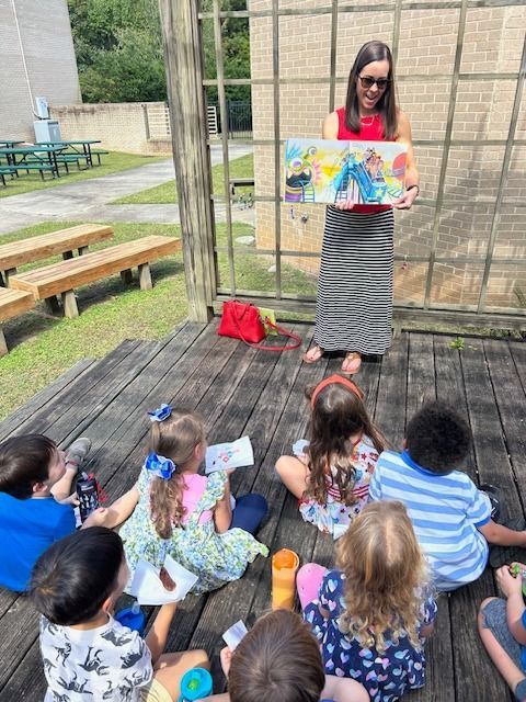 parent volunteer reading at TBOP