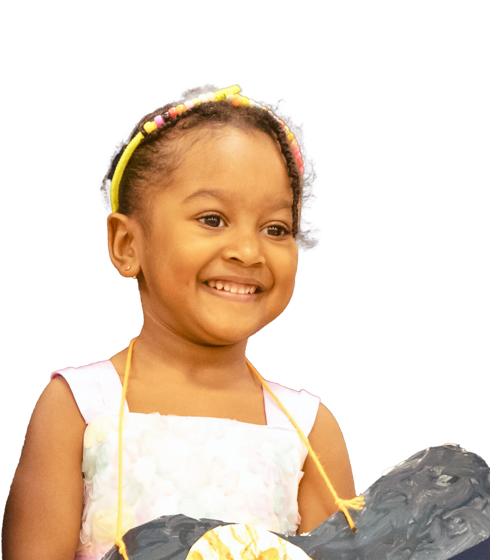 Woman with short, wavy gray hair wearing glasses, smiling, lit by sunlight.