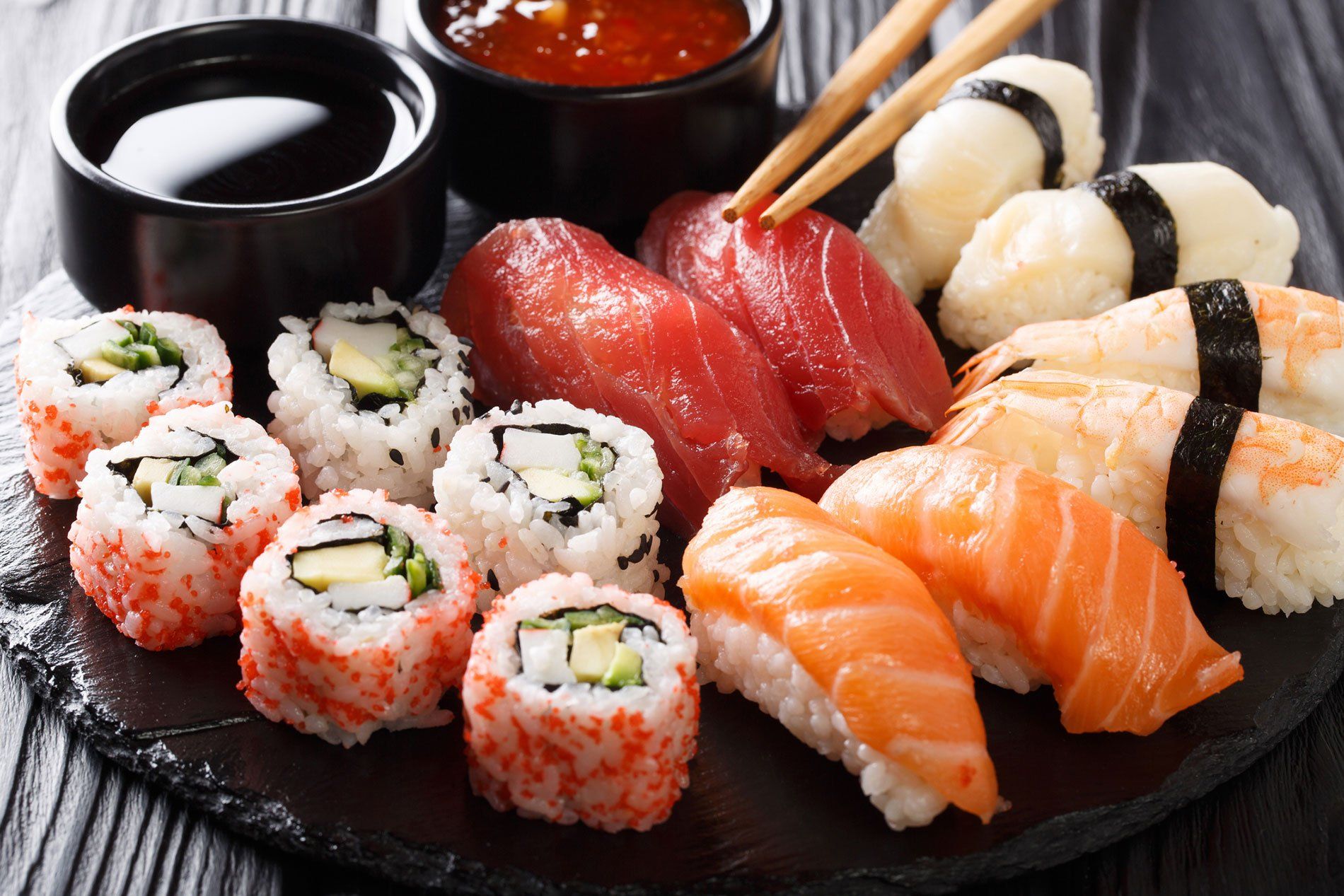 Variety of sushi food. nigiri, maki, uramaki and roll with tuna, salmon and shrimp. Asian food with raw fish and rice.
