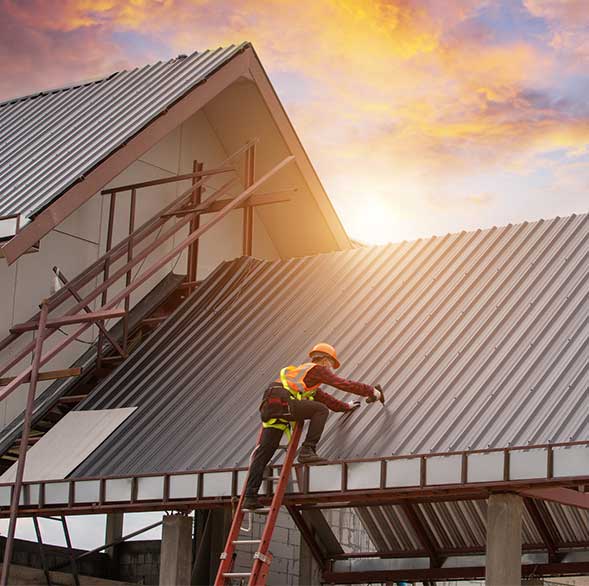 Residential roofing contractors working on a home in Council Bluff, IA