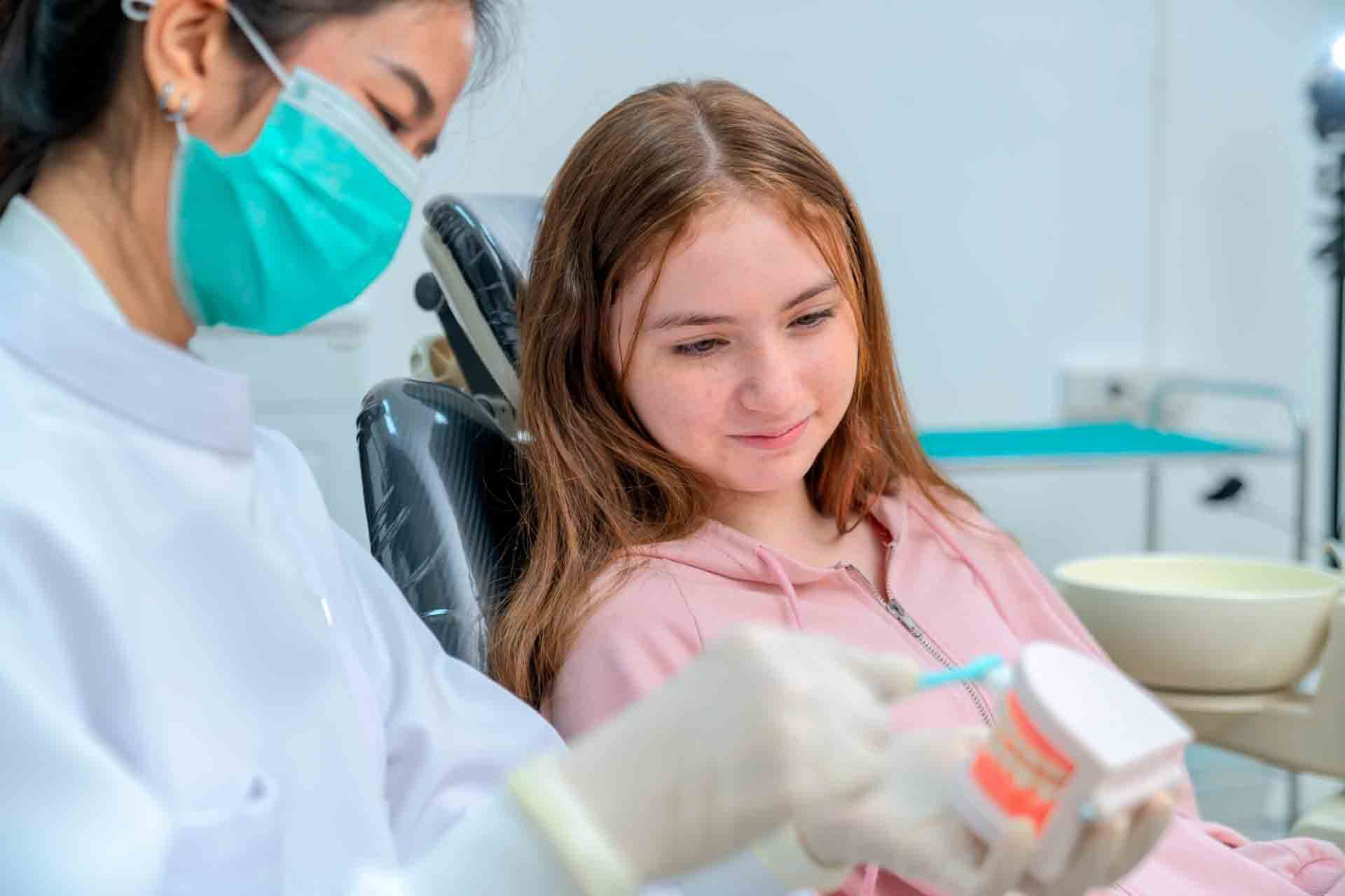 The dentist teaches the kid how to care for the teeth – Blacktown, NSW – Smiles for All