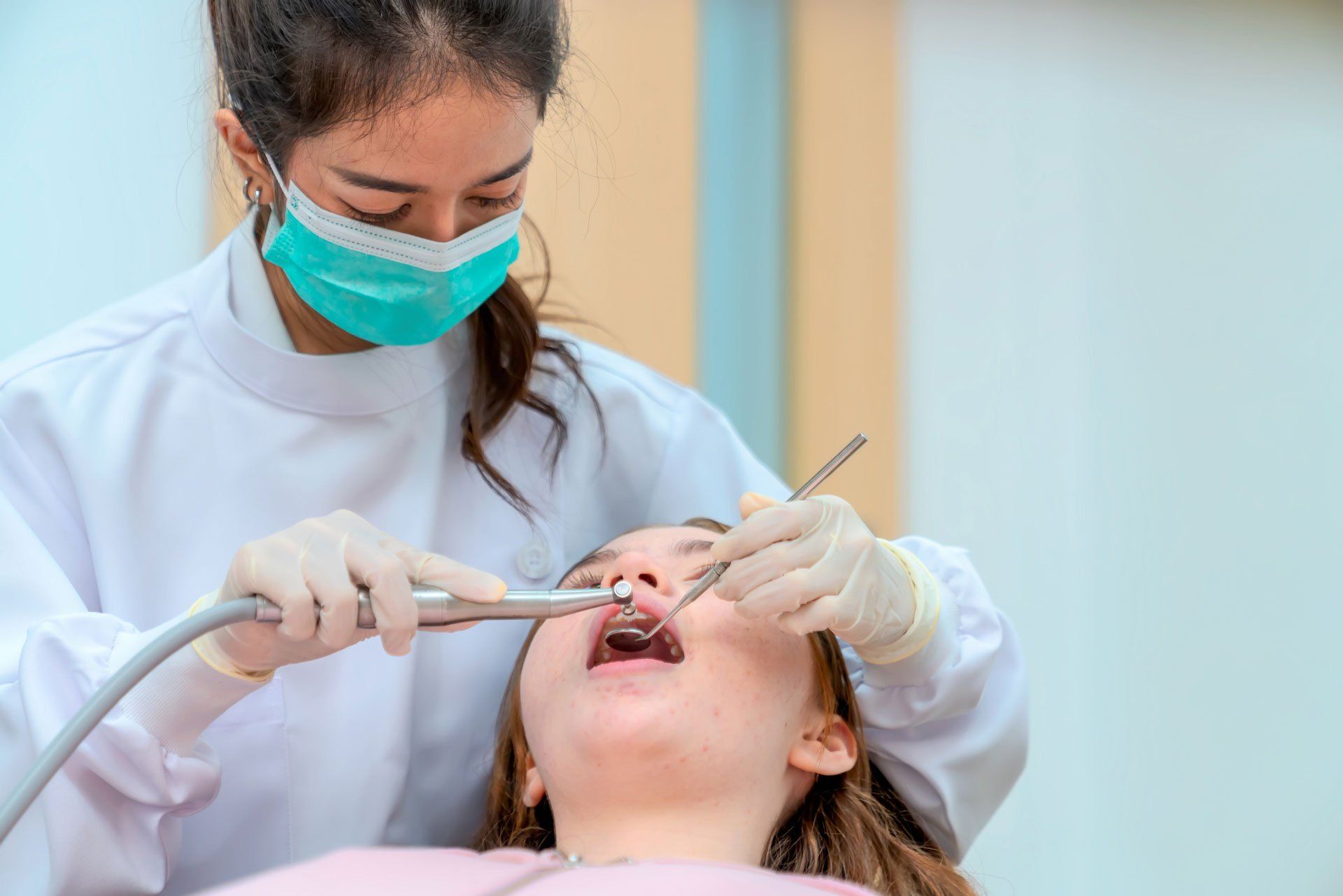 Dental hygienist working on the girl's teeth – Blacktown, NSW – Smiles for All