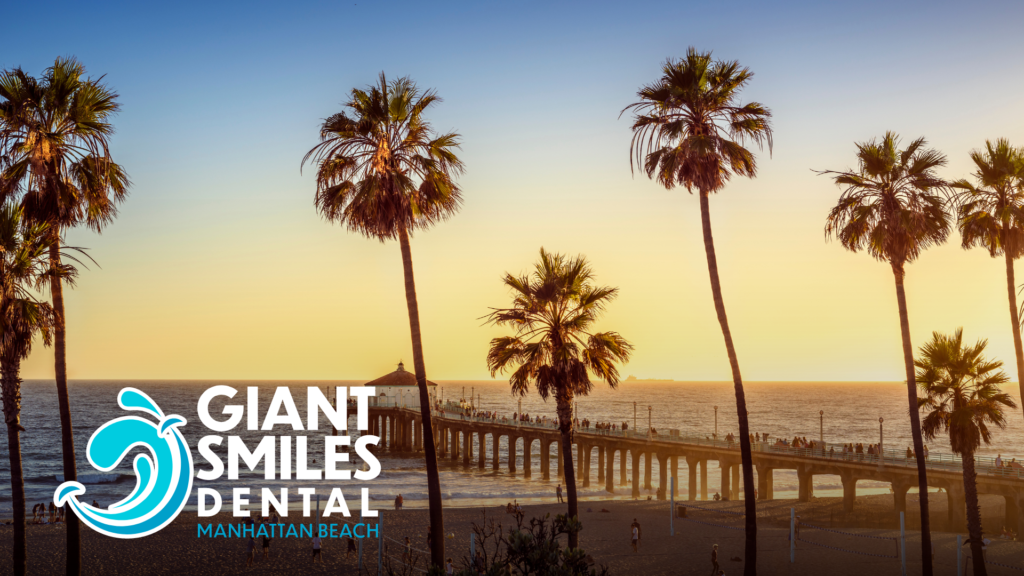 There are many palm trees on the beach at sunset.