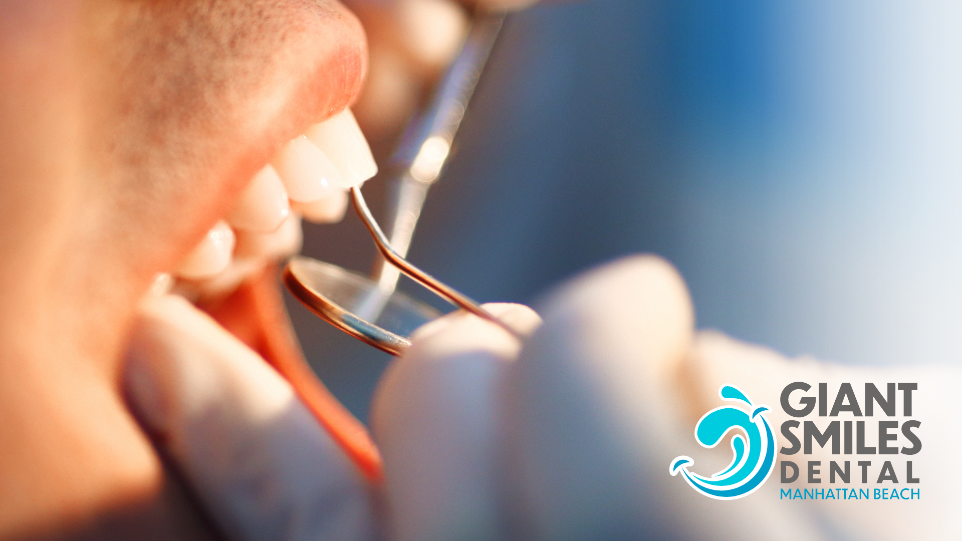 A person is getting their teeth examined by a dentist.