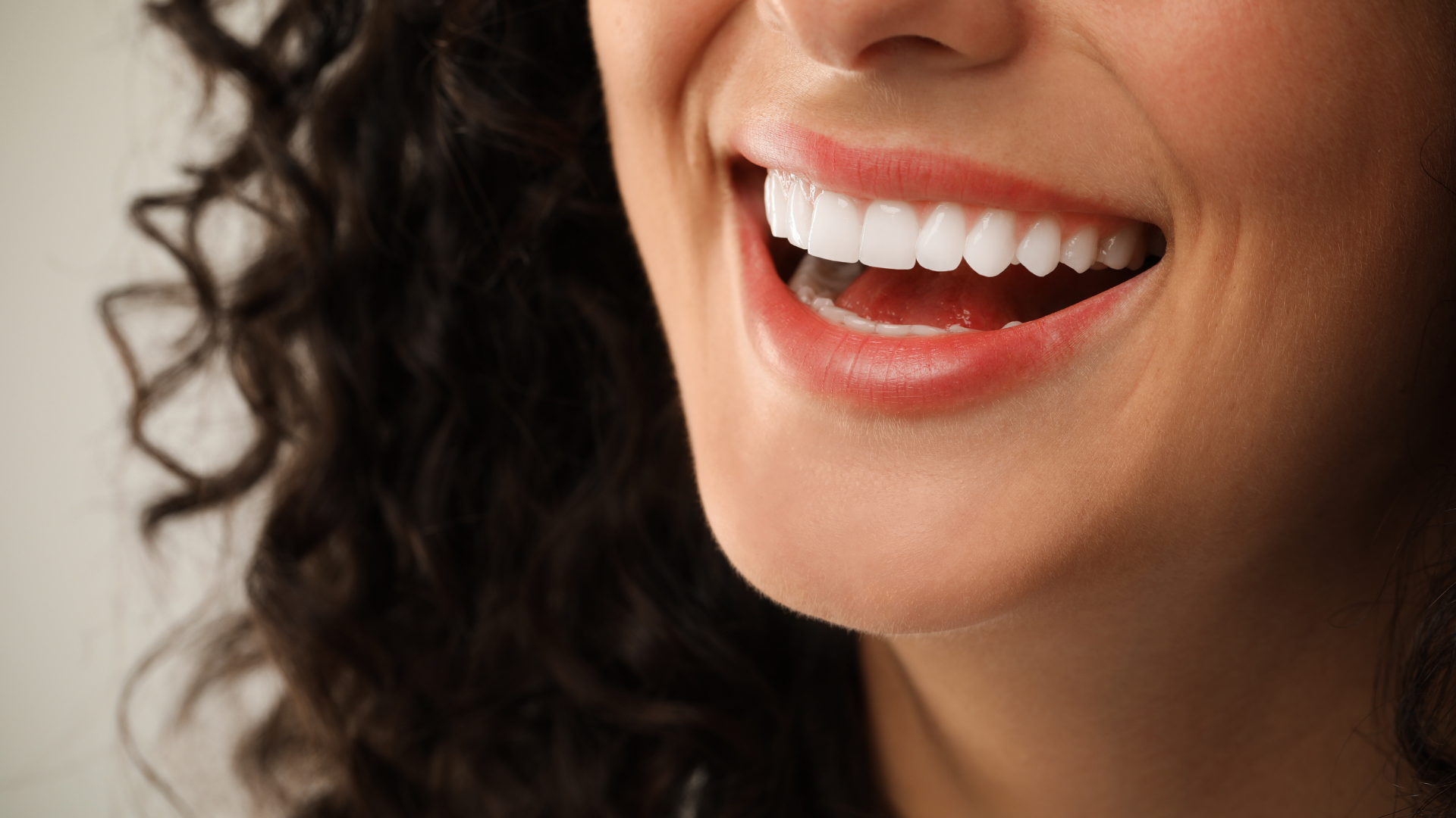Smiling mouth with bright white teeth.