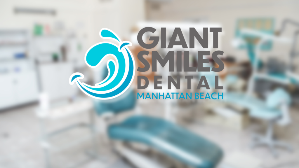 A blurry picture of a dental office with the logo for giant smiles dental manhattan beach.