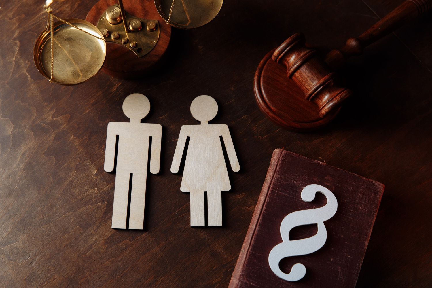 A man in a blue shirt and tie is using a laptop computer.