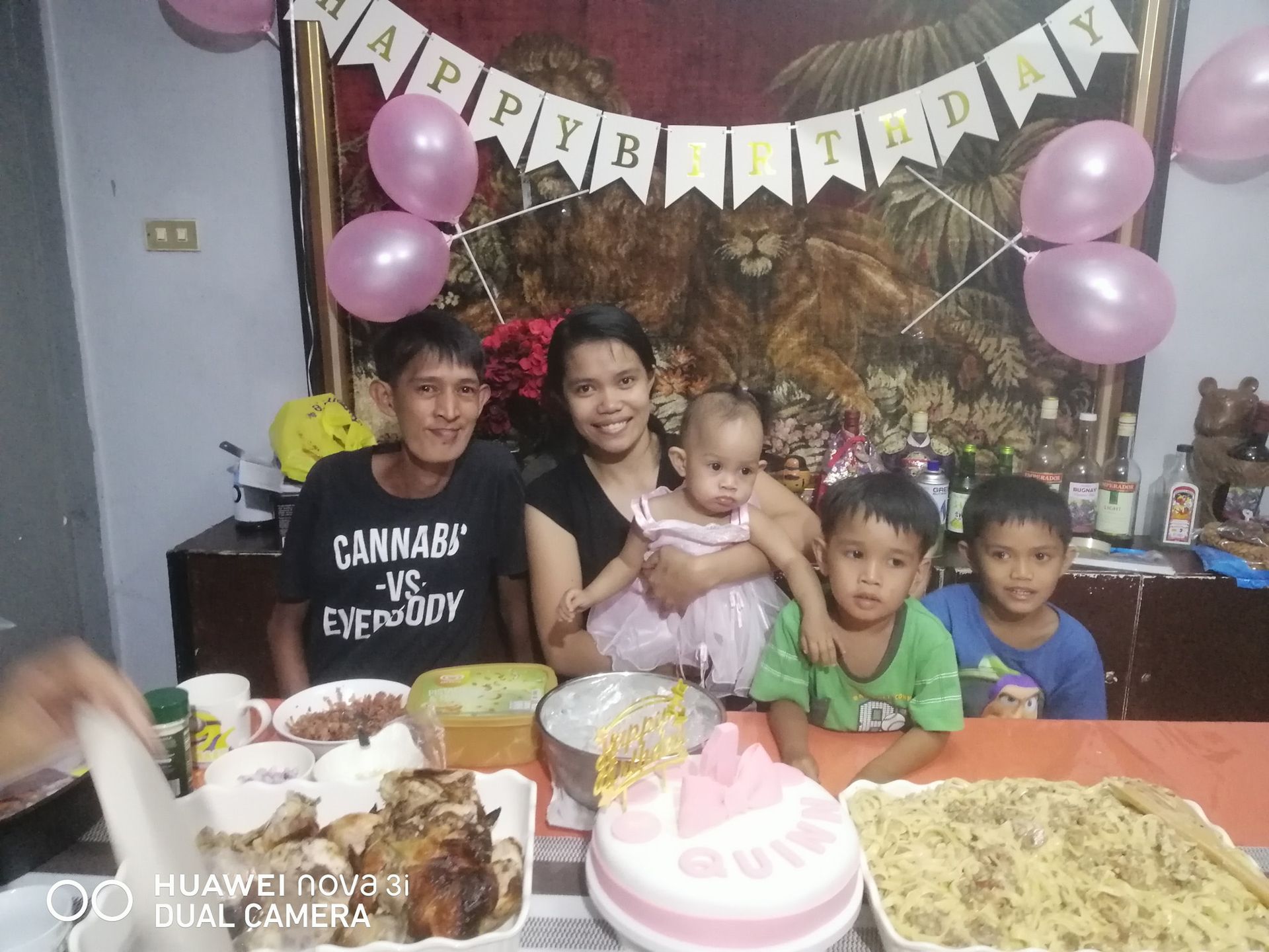 Family celebrating a birthday. Balloons and