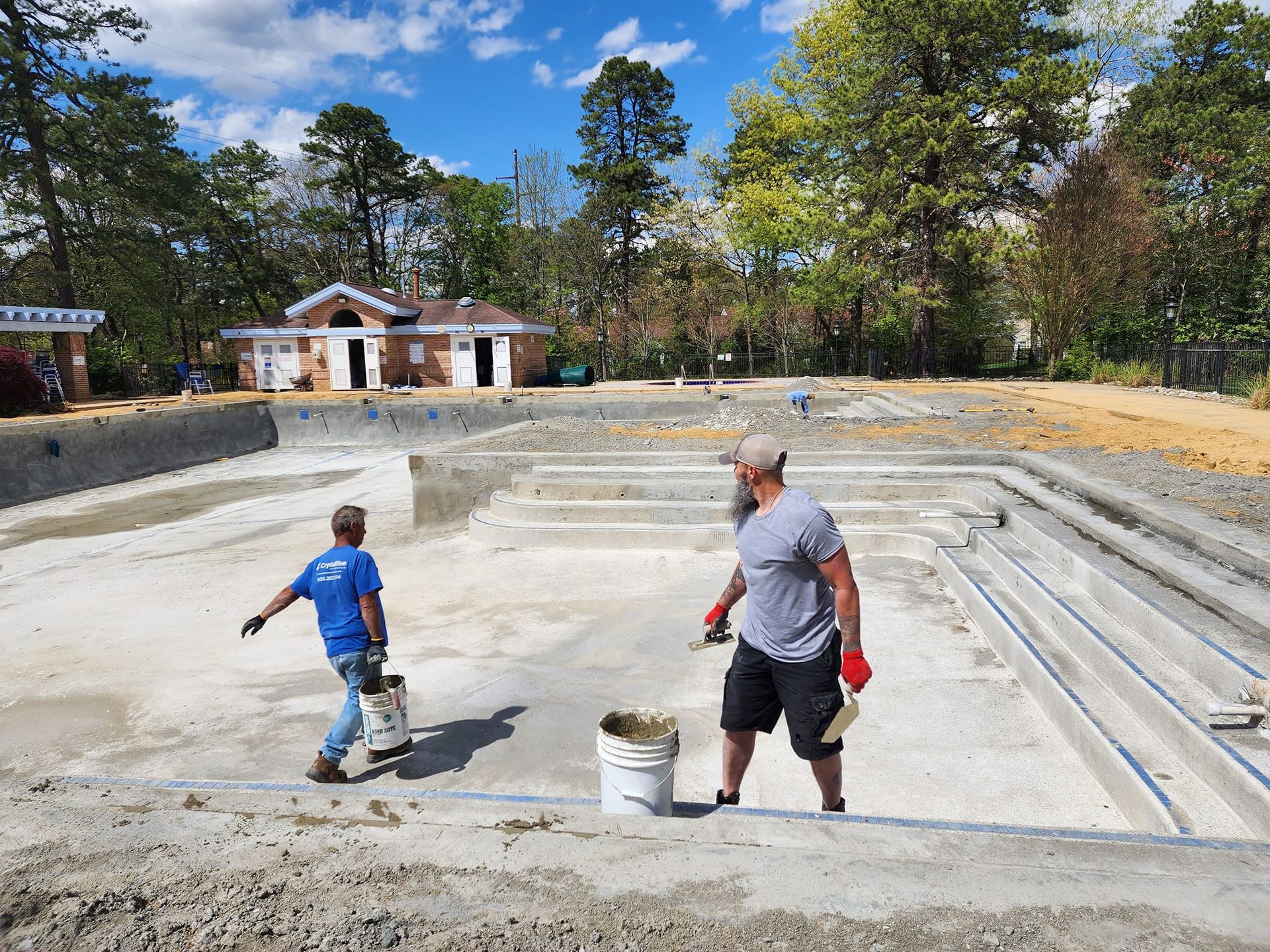 Two Men Working on a New Pool — Mantua Township, NJ — Crystal Blue Pool Renovation