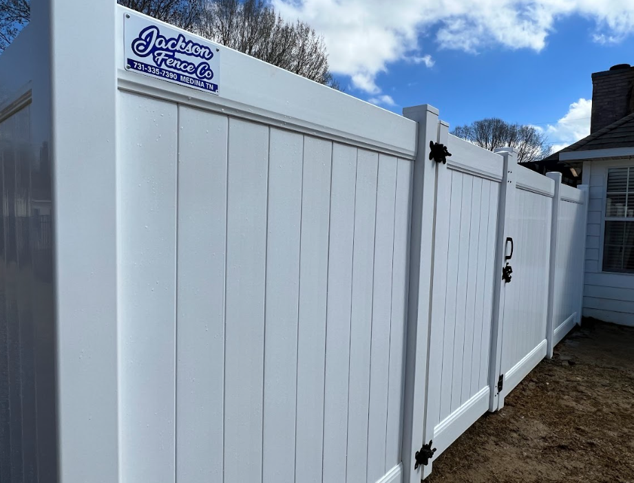 A white wooden fence with a gate on a white background.