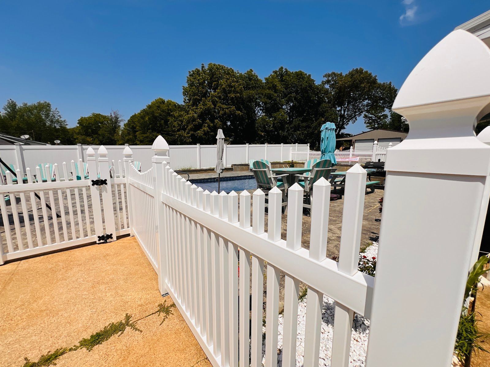 A white picket fence with a sign that says jackson fence co.