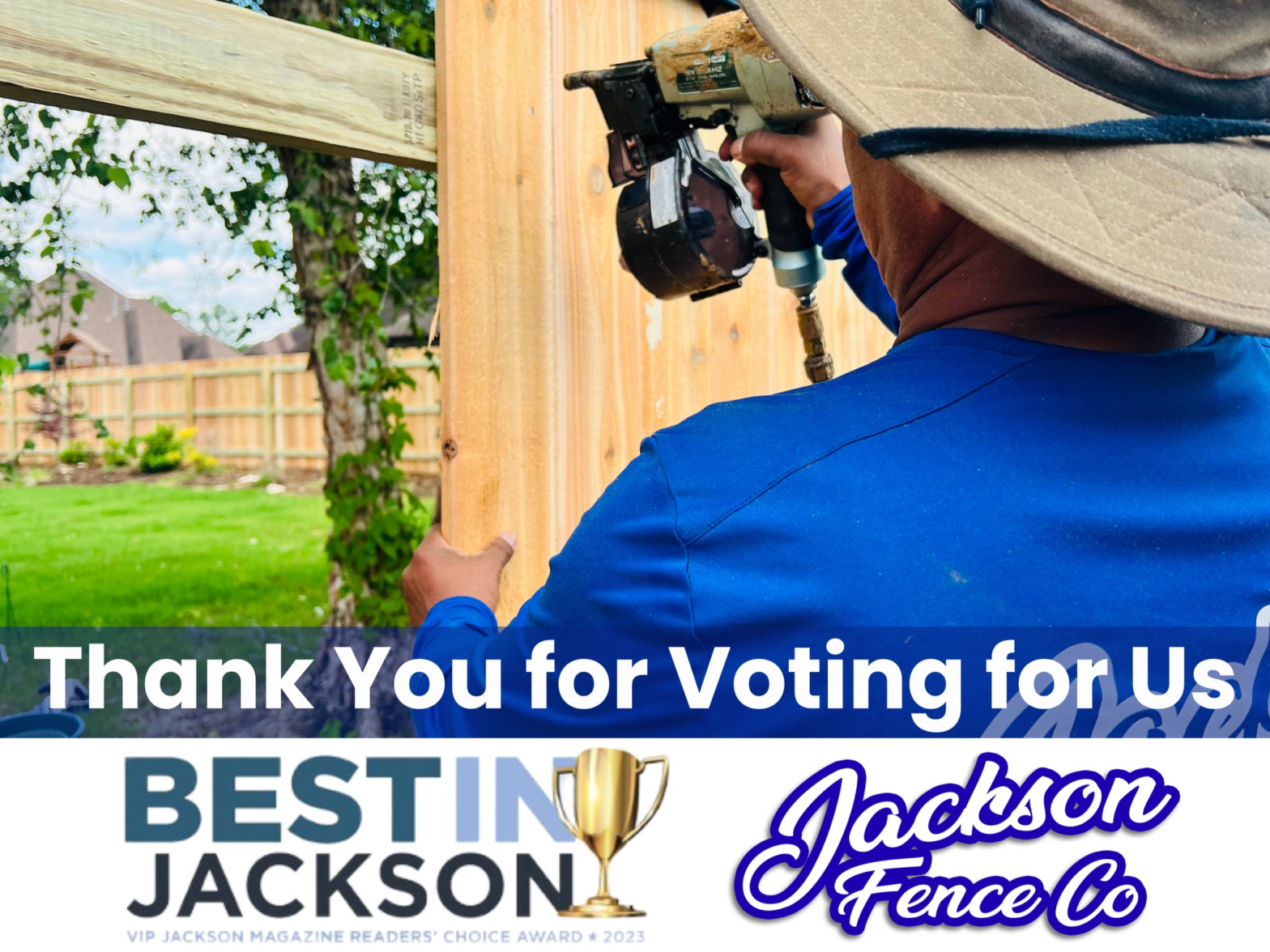 A man wearing a hat is working on a wooden fence